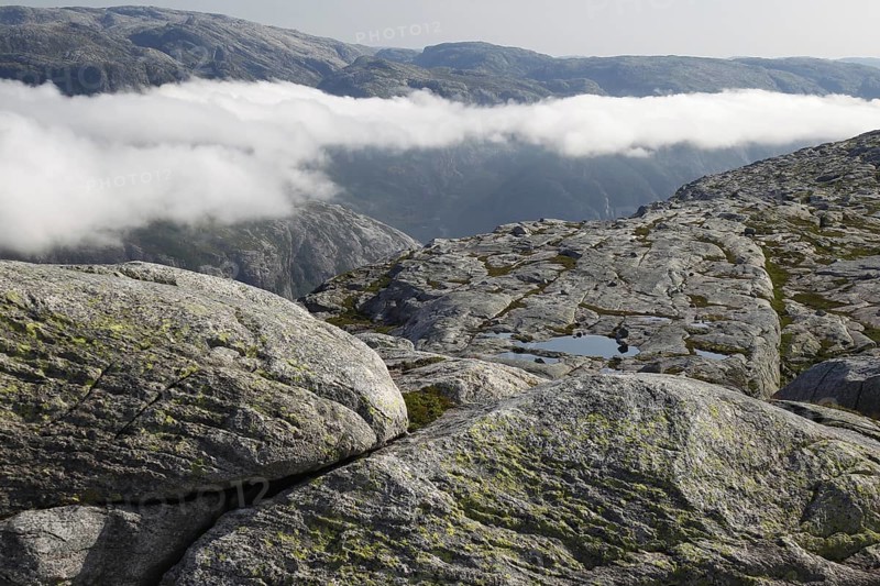 Wide rocky landscape with cloud cover over the Kjerag Plateau, Lysefjord, Rogaland, Norway