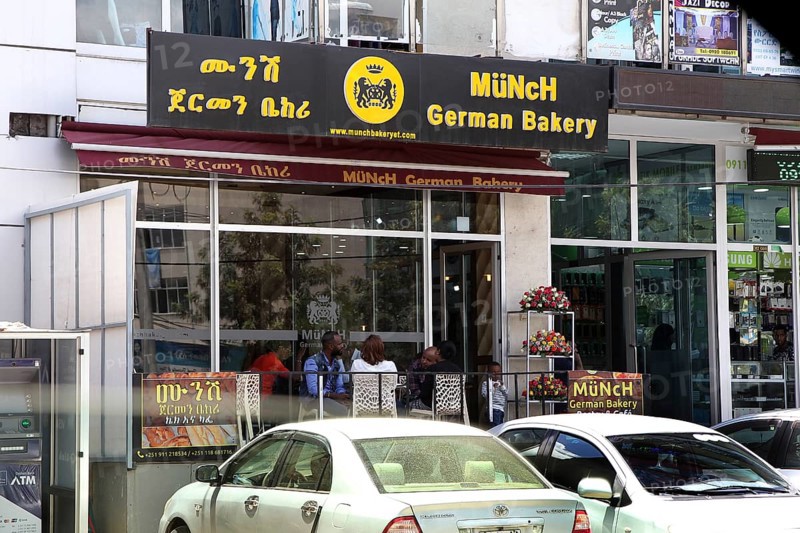 Modern German cafe in an urban setting in Addis Ababa, with cars in the foreground, Addis Ababa, null, Ethiopia