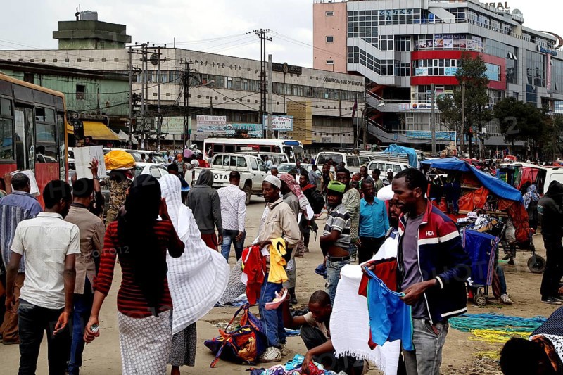 Bustling market area with lots of people and an urban backdrop, Addis Ababa, Mercato, Ethiopia