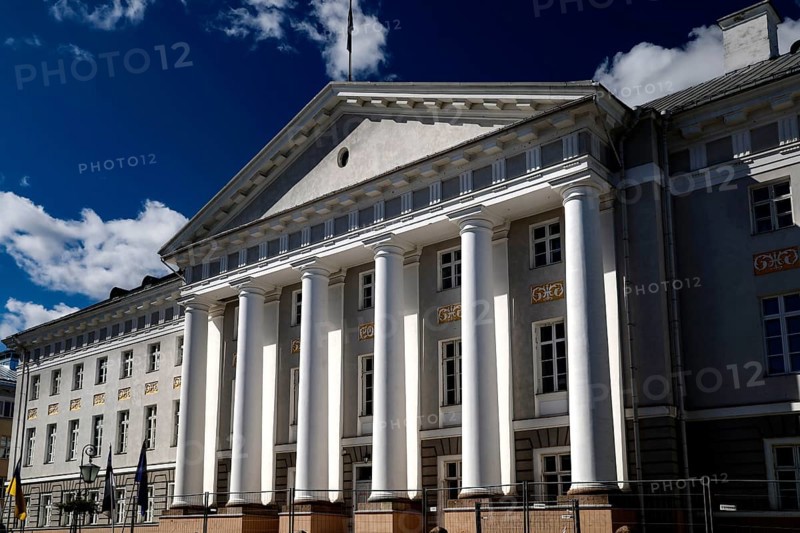 Impressive university with pillars in the old town of Tartu under a blue sky, Tartu, Estonia