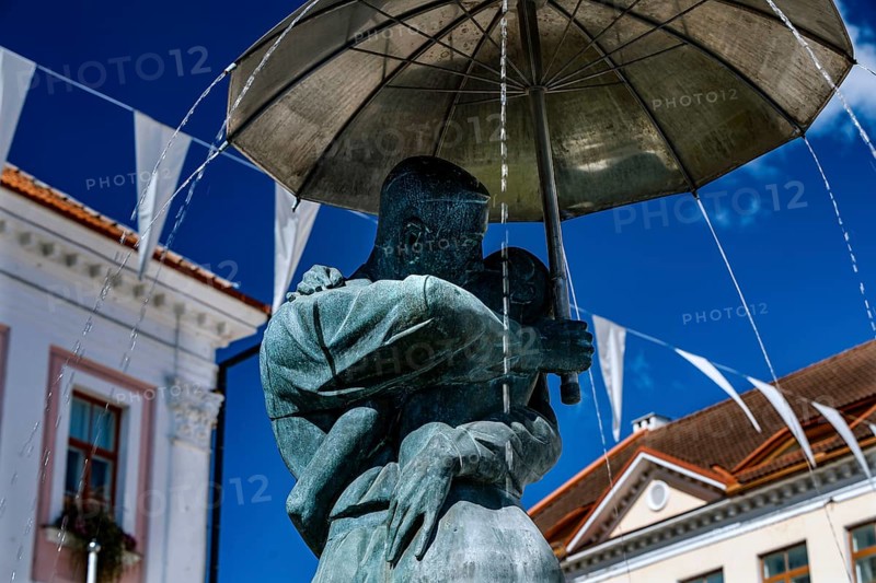 Close-up view of the sculpture of students kissing with umbrella, a landmark of Tartu, against the clear sky, Tartu, Estonia