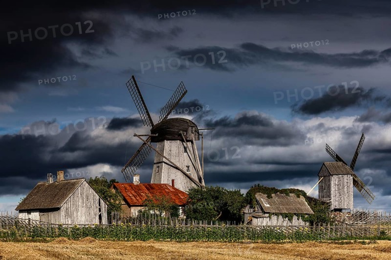 Traditional windmills against dramatic skies in Angla, Angla, Saaremaa, Estonia
