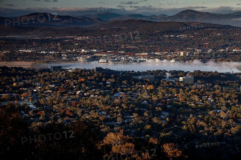Panoramic view from Mount Ainslie of Canberra's western suburbs and countryside at dusk, Canberra, Australian Capital Territory, Australia
