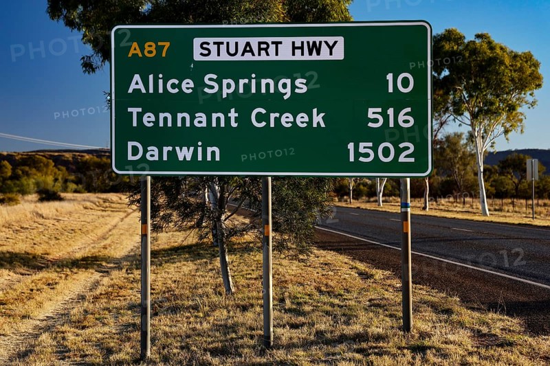 Sign showing distances to Alice Springs and Darwin on Stuart Hwy, Alice Springs, Australia