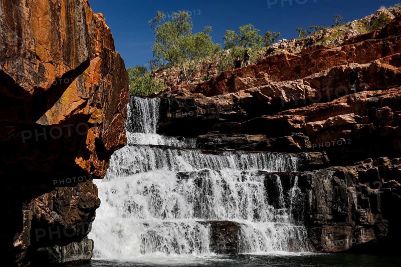 Impressive waterfall in Bell Gorge that flows over several rock steps, Bell Gorge, Australia