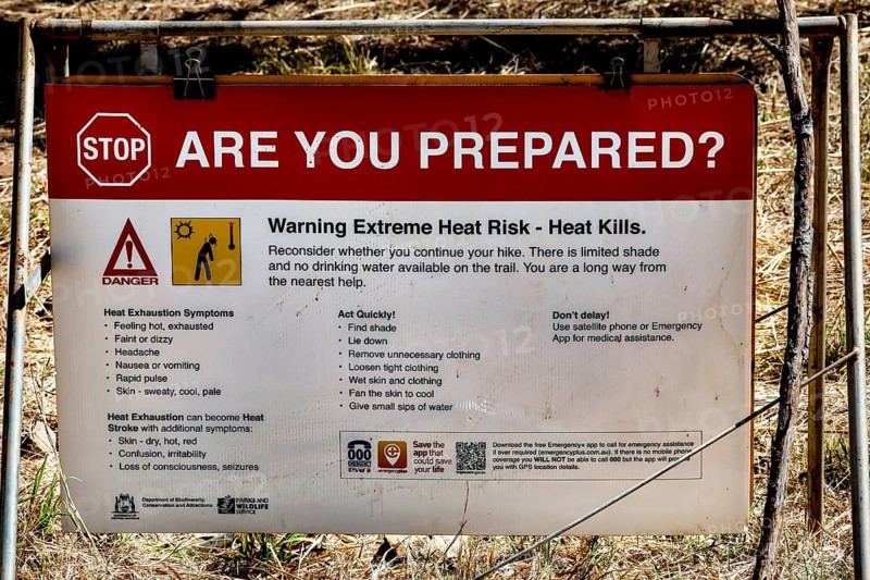 Warning sign in Bell Gorge warning of extreme heat and safety measures, Bell Gorge, Australia