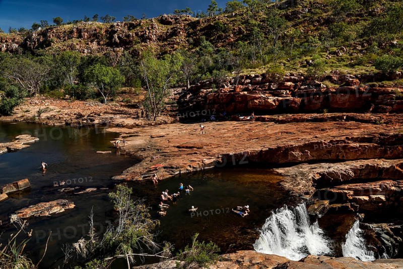 Bell Gorge with impressive waterfall and surrounding rocks and vegetation in Australia, zero