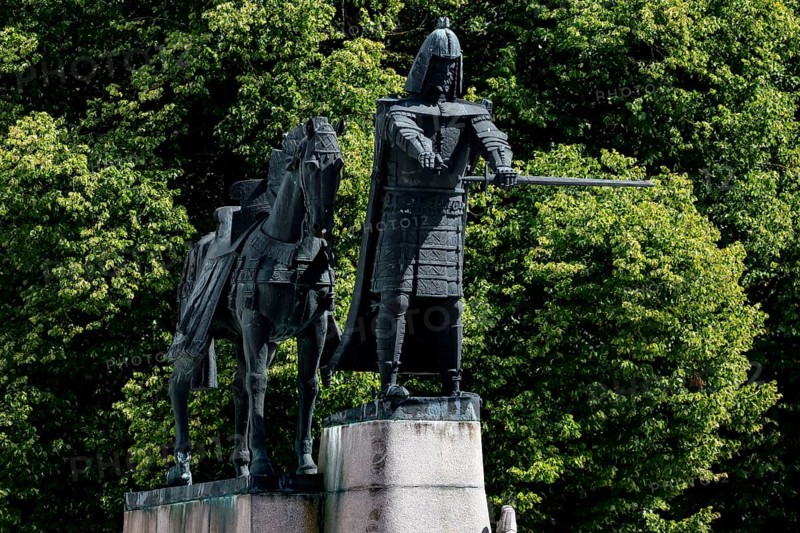 Gediminas monument in front of thick trees on Cathedral Square, Vilnius, Lithuania