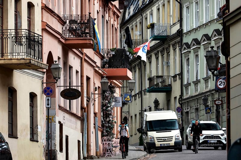 Busy street with cars and flags in the artistic district of Vilnius' Užupis, Vilnius, Užupis, Lithuania
