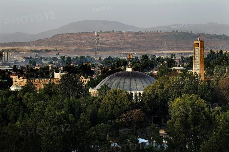 View of St. Mary's Cathedral in Axum from Yeha Hotel with surrounding greenery and mountains in the background, Axum, Ethiopia