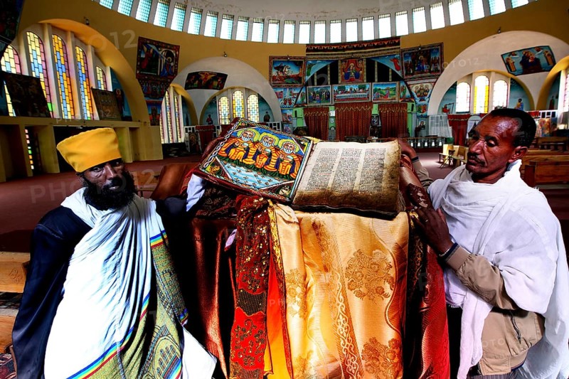 Priests present an opened Bible at St. Mary's Cathedral in Axum during a ceremony, Axum, Tigray, Ethiopia