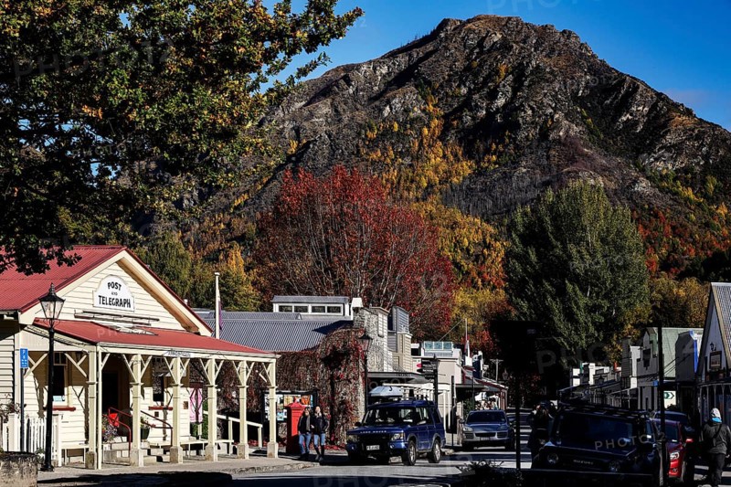 Picturesque autumn scene in Arrowtown with colorful foliage and mountains, Arrowtown, New Zealand