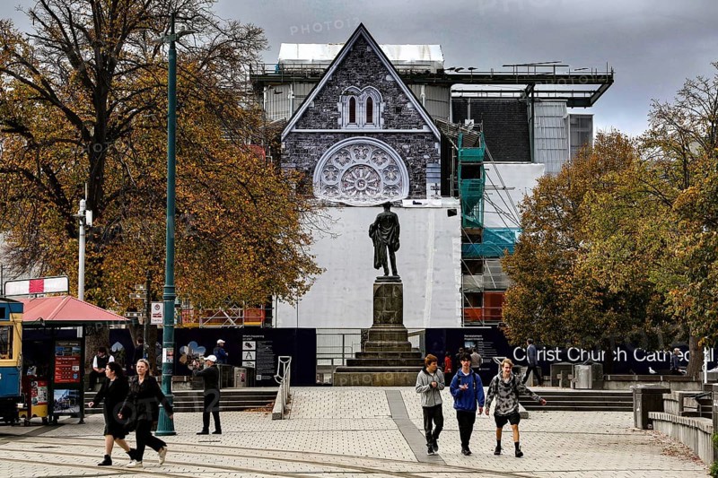 Cathedral and monument at Cathedral Square in Christchurch with passers-by, Christchurch, Canterbury, New Zealand