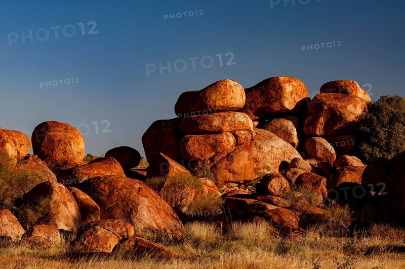 Dense collection of impressive rocks under bright blue sky, Devil's Marbles, Northern Territory, Australia