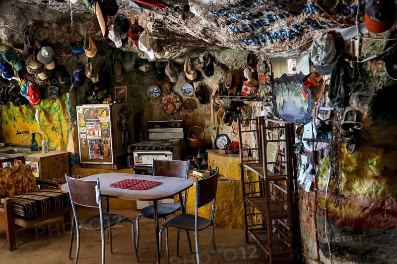 Quiet dining area in a cave filled with decorations in Coober Pedy, Coober Pedy, South Australia, Australia