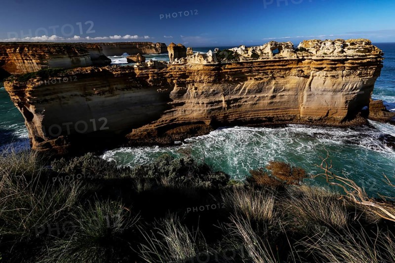 The impressive rock formation The Razorback on the Great Ocean Road surrounded by waves, Great Ocean Road, Victoria, Australia
