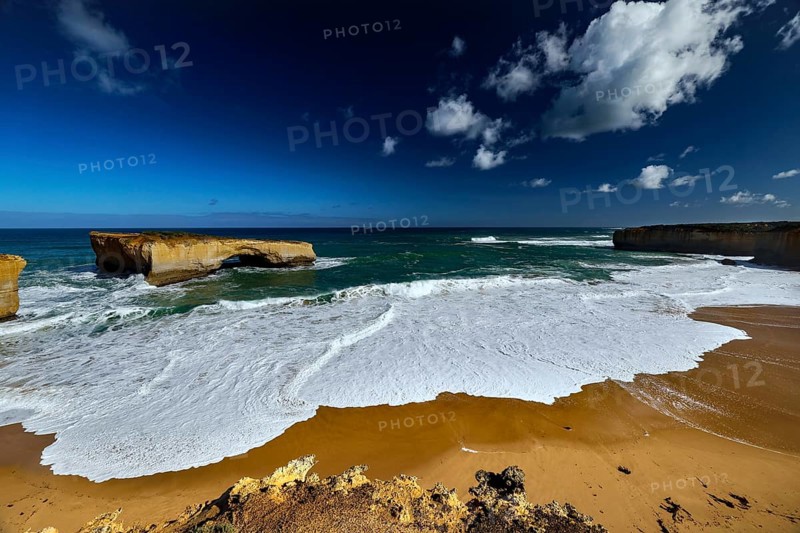 The London Bridge coastal formation on the Great Ocean Road with impressive rocks and waves, Great Ocean Road, Victoria, Australia