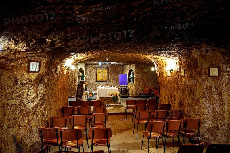 Underground chapel in Coober Pedy with standing pews and altar table, Coober Pedy, South Australia, Australia
