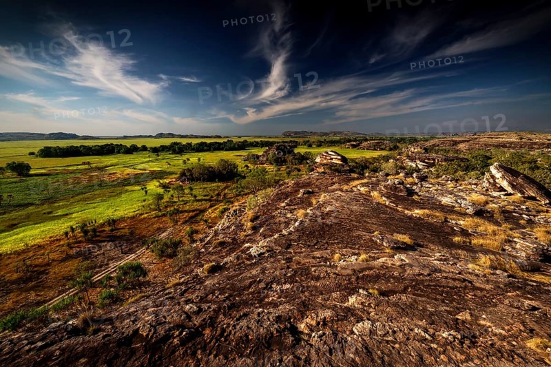 Rugged landscape under dramatic skies from Nardab Lookout in Ubirr, Kakadu National Park, Ubirr, Northern Territory, Australia