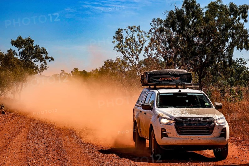 Dusty off-road vehicle on Gibb River Road, Gibb River Road, Western Australia, Australia