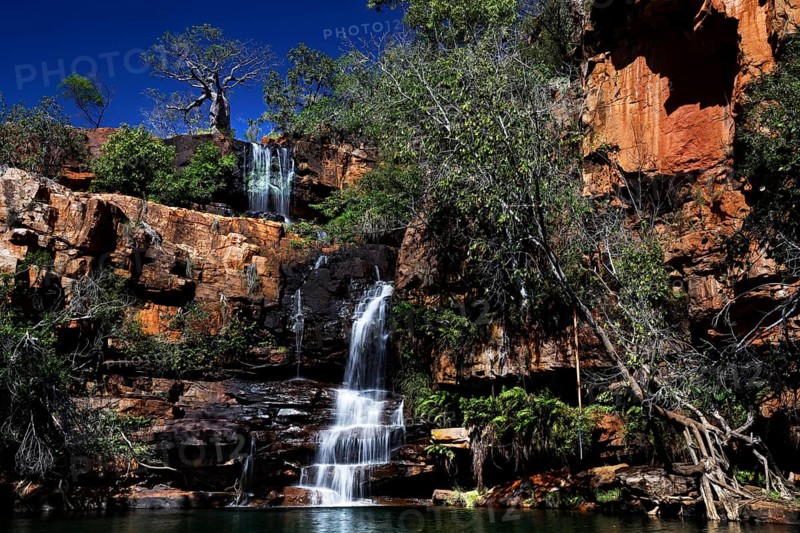 Impressive waterfall amidst pristine rocky landscape of Galvans Gorge, Galvans Gorge, Kimberley, Australia