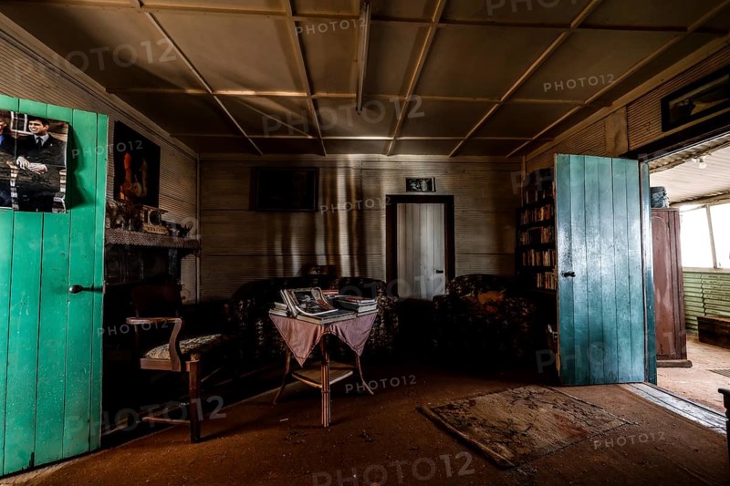 Living room with antique furniture and rustic charm, zero