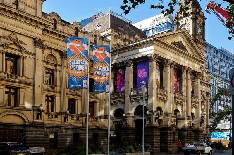 Historic Town Hall on Swanston Street in Melbourne with decorative posters, Melbourne, Victoria, Australia