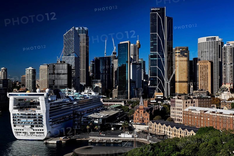 View of Sydney skyline with a large cruise ship in the foreground, Sydney, New South Wales, Australia