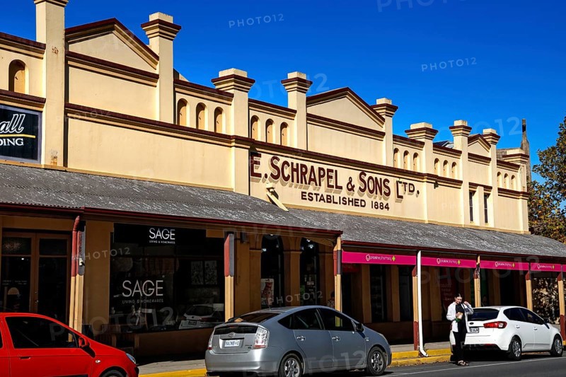 Historic building on Tanunda's main street with signs and shop windows, Tanunda, South Australia, Australia
