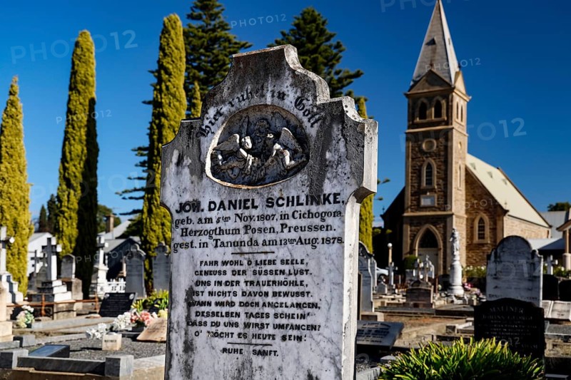 The Langmeil Lutheran cemetery with tombstones in front of a church in Tanunda, Tanunda, South Australia, Australia