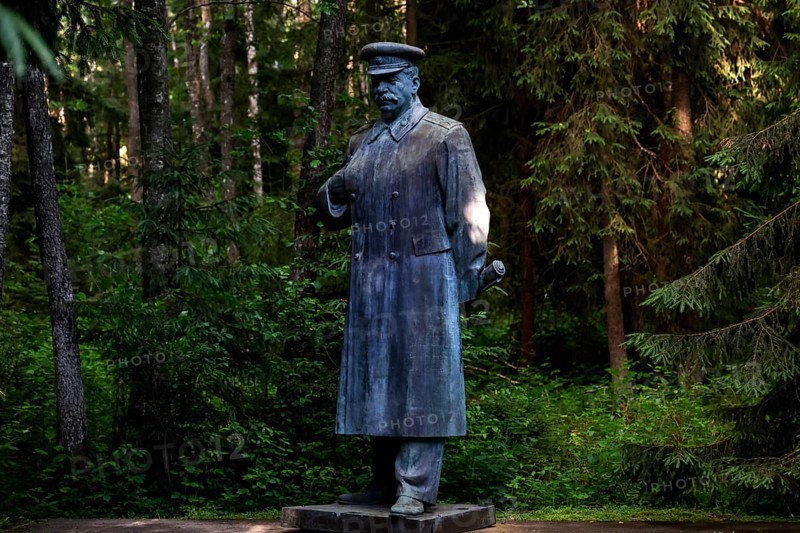 Stalin monument in Grutas Park surrounded by thick, green forests, Druskininkai, Lithuania