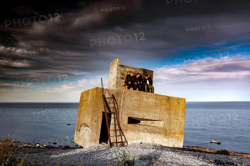 Abandoned bunker on a stormy coast with dramatic clouds, Sääre, Saaremaa, Estonia
