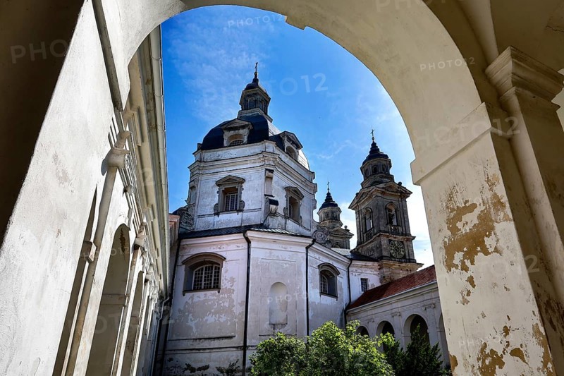 Baroque Pažaislis monastery with towers and arches under blue sky, Kaunas, Kauno apskritis, Lithuania