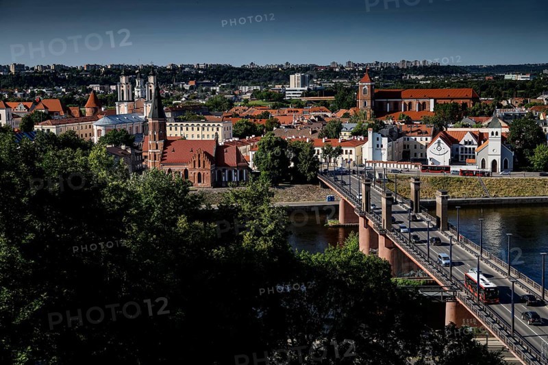 View of Aleksota's bridge and old town with river in the foreground, Kaunas, LT