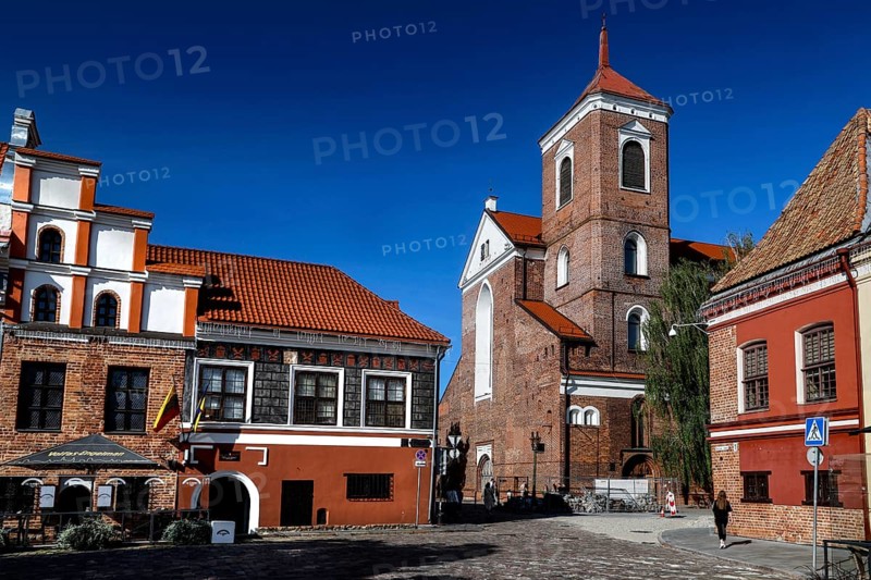 Historic buildings on Town Hall Square, Rathausplatz, Rathausplatz with an impressive cathedral under clear skies, Kaunas, Kaunas County, Lithuania
