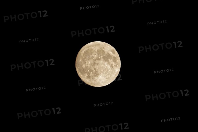Full moon in the night sky, no clouds, black background. Poznan, Poland