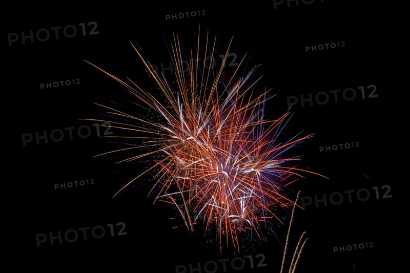 Fireworks in the night sky on New Year's Eve. Bad Salzschlirf, Hessen, Germany