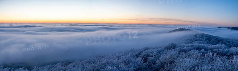 Wide, snowy landscape under a calm sky at dusk, panoramic view of the Teutoburg Forest from an elevated position, Steinegge observation tower, Dissen, Osnabrück district, Lower Saxony, Germany