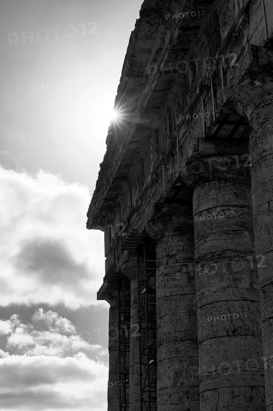 Elymian Doric Temple, ruin, monochrome, sunbeams, ancient city of Segesta, archaeological site, Calatafimi, Trapani province, northwest, Sicily, southern Italy, Italy