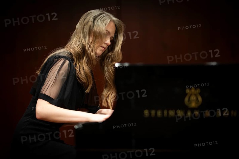 Young woman, pianist, pianist with concentrated facial expression playing on a Steinway & Sons grand piano, Stuttgart, Baden-Württemberg, Germany