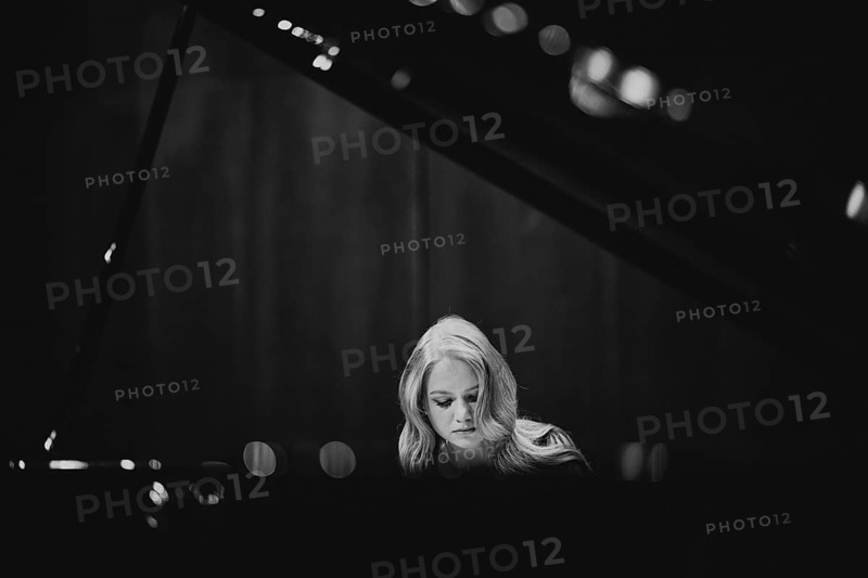 Young woman, pianist, with concentrated facial expression playing on a Steinway & Sons grand piano, black and white photo, Stuttgart, Baden-Württemberg, Germany