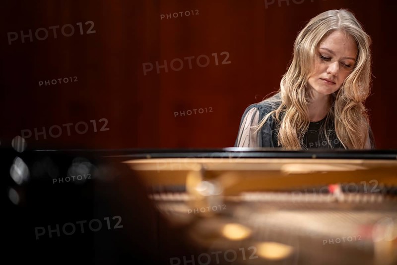 Young woman, pianist, with concentrated facial expression and closed eyes playing on a Steinway & Sons grand piano, Stuttgart, Baden-Württemberg, Germany
