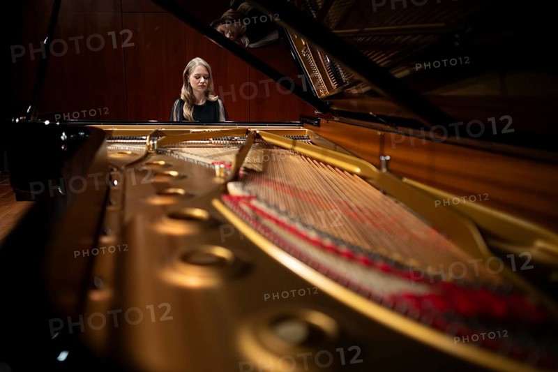 Young woman, pianist playing on an unfolded Steinway & Sons grand piano, Stuttgart, Baden-Württemberg, Germany