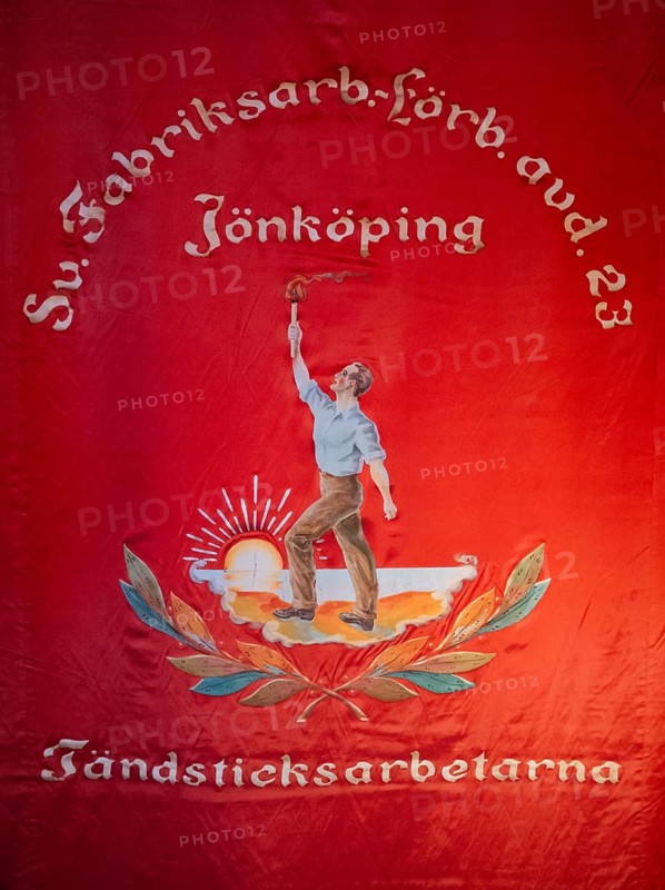 Red flag showing a worker with a torch in front of the rising sun, Tändsticksmuseet match museum or match museum, Jönköping, Jönköpings län, Sweden