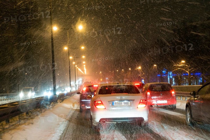 Traffic jam, city traffic due to snow flurries, blowing snow, Upper Bavaria, Germany