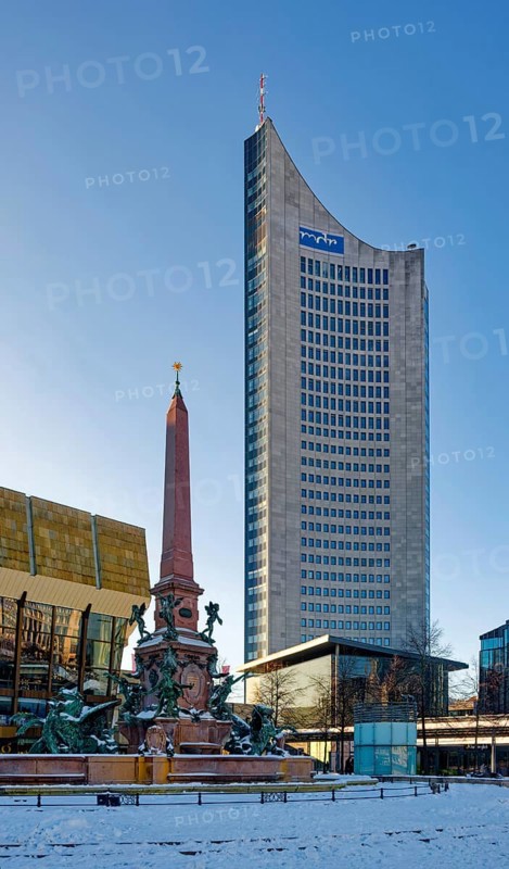 Mendebrunnen, Gewandhaus and City Tower on Augustusplatz in winter with snow, Leipzig, Saxony, Germany