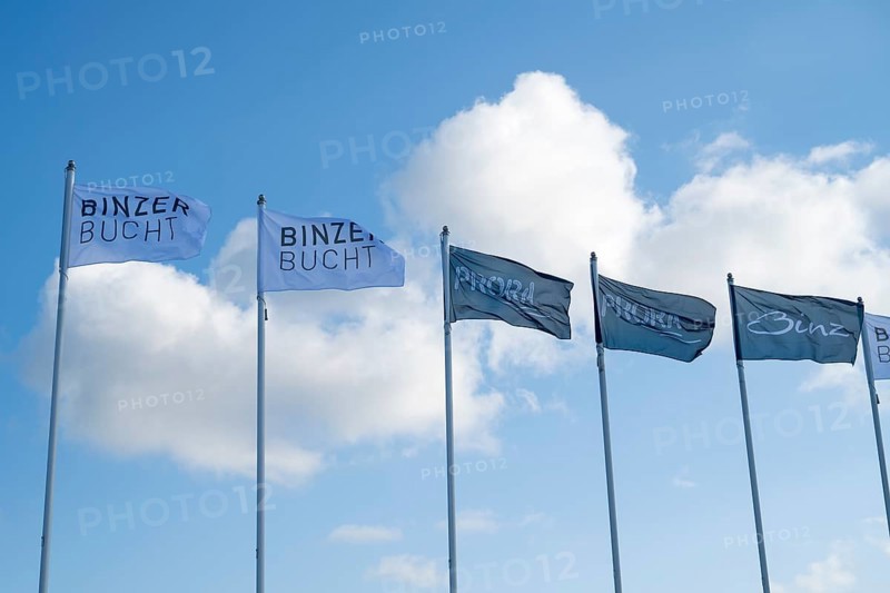 Flags against a blue sky with clouds, writing Binzer Bay and Prora, Binz, seaside resort, Rügen island, Mecklenburg-Western Pomerania, Germany