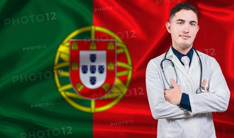 Portrait of medical professional on Portugal flag background. Portuguese national health system