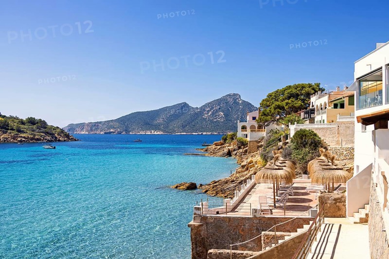 House with terraces on the shores of the Mediterranean sea with a scenics view to the sea a sunny summer day, Sant Elm, Mallorca, Spain