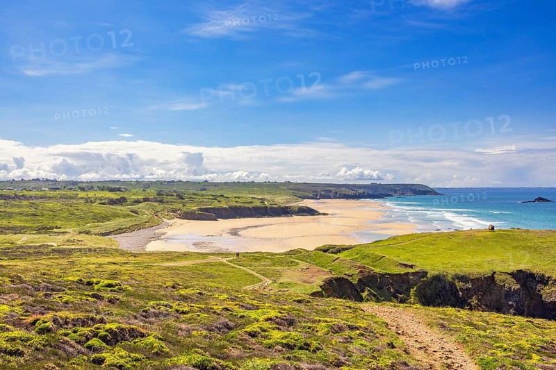 Scenics view at a natural sand beach from a flowering lush green moor with walking trails a sunny summer day, Plage de Lostmarc'h, Crozon peninsula, Bretagne, France